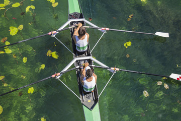 Two rowers  rowing