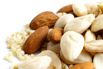 Detail of whole, chopped and blanched almonds mixed together.