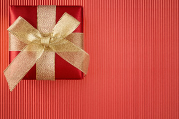 Gift box on red corrugated paper
