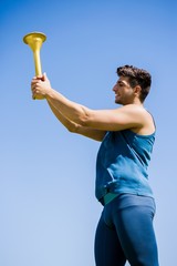 Athlete holding a fire torch
