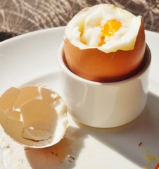 Eating a soft boiled egg for breakfast