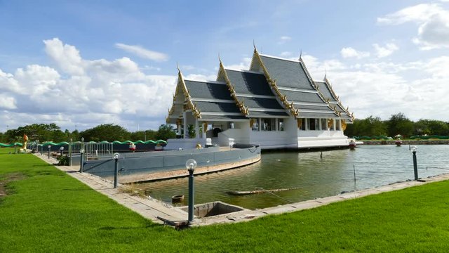 Church of Buddha temple middle of the water located in Singburi, Thailand. Time lapse.