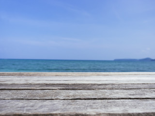 Fototapeta na wymiar Table top Wood Plank with Beach Sea Summer Holiday Background