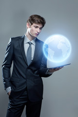 Young businessman with touch screen computer