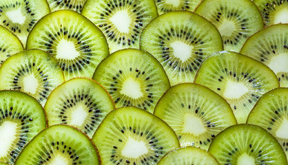 fresh kiwifruit background. round slices closeup
