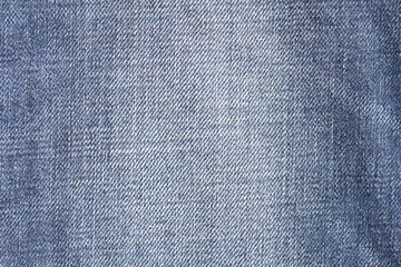 Closeup denim jeans texture. Stitched textured blue jeans denim fabric background. Old grunge vintage denim jeans.