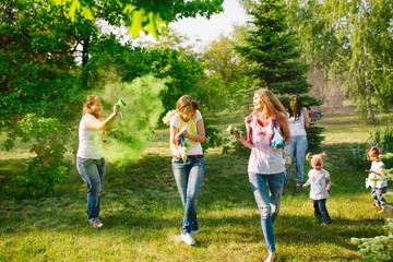 Fototapeta premium European people celebrate Indian holi festival with colorful pai