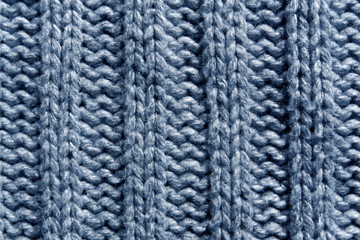 Abstract blue knitting texture close-up.