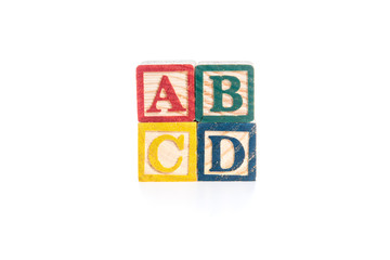 photo of a alphabet blocks spelling ABCD isolate on white backgr