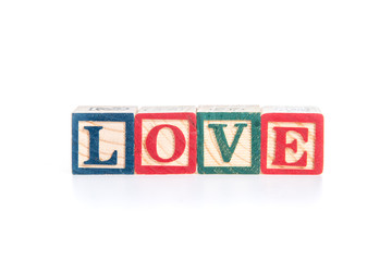 photo of a alphabet blocks spelling LOVE isolate on white backgr