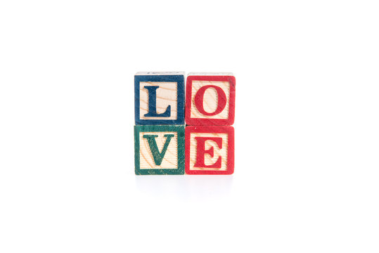 photo of a alphabet blocks spelling LOVE isolate on white backgr