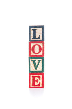 photo of a alphabet blocks spelling LOVE isolate on white backgr