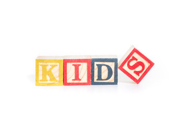 KIDS with colorful alphabet blocks on white background