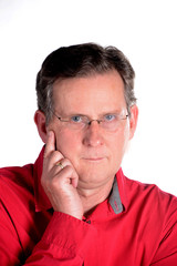 Obraz premium Caucasian middle aged man in red shirt white background