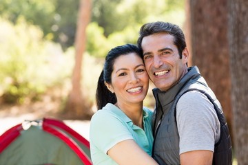 Fototapeta premium Portrait of couple smiling and holding each other