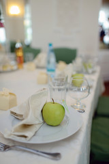 Beautiful wedding restaurant for marriage. White decor for bride and groom. Colorful decoration for celebration. Beauty bridal interior. Bouquet; food and flowers in hall