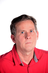 Obraz premium Caucasian middle aged man in red shirt white background