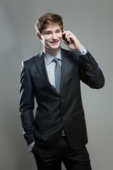 Young business man talking on cell phone