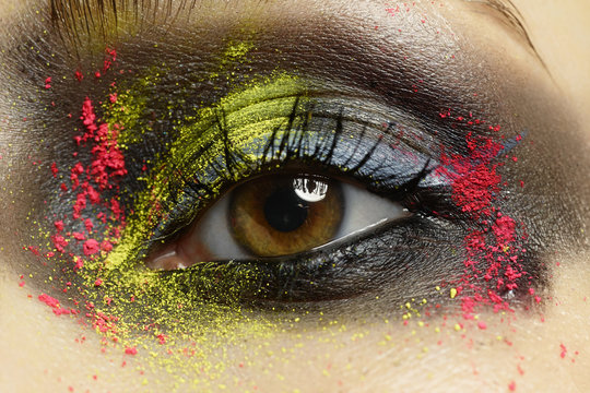 Close up of a woman with colourful eye make up