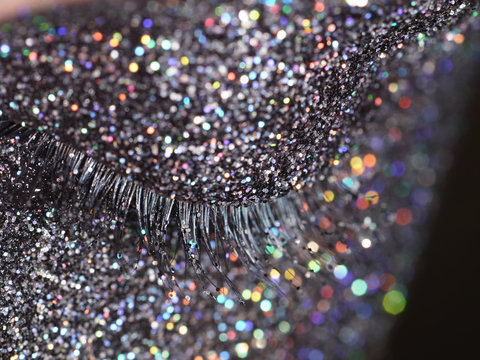 Close up of a woman's closed eye with glittering make up