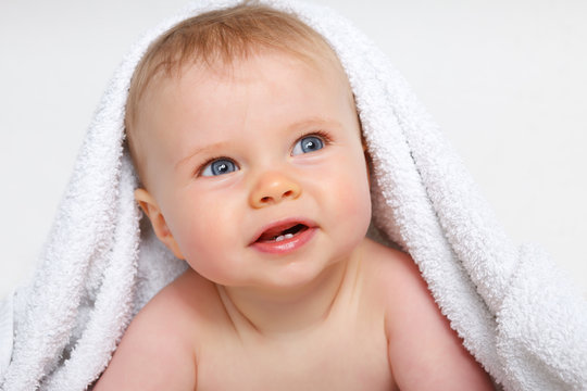 baby under a towel
