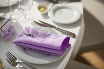 Table setting with lavender flowers, close-up