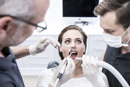 Young woman at the dentist receiving treatment