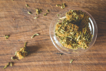 Fototapeta na wymiar Marijuana buds in the glass plate