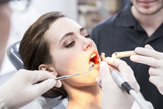 Young woman at the dentist receiving treatment