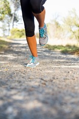 Close up woman runners legs running 