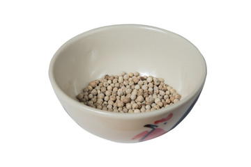 Isolated bowl of white dried pepper on a white background