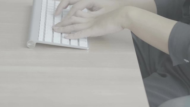 Woman hands typing on a computer keyboard (Slog)