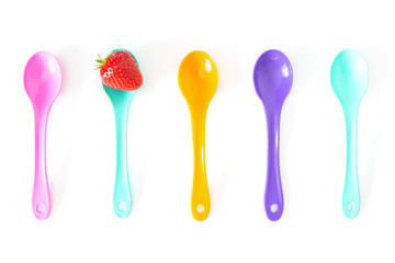 Strawberry on a bright saucer isolated white