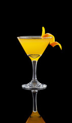 Orange cocktail over black background
