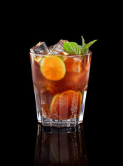 Fresh cold alcohol drink over black background