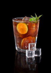Fresh cold alcohol drink over black background