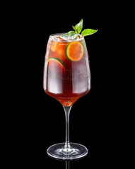 Fresh cold alcohol drink over black background