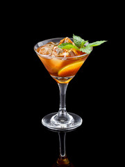Fresh cold alcohol drink over black background