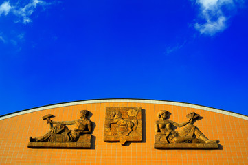 Cerna louka exhibition ground, Ostrava, Czech Republic / Czechia - building gable with relief (industry and agriculture) in the style of socialist realism. Coat of arms of Ostrava city. 
