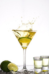 Yellow cocktail splash on white background
