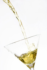 Yellow cocktail splash isolated on white background
