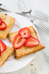 Cake of puff pastry with fresh strawberries