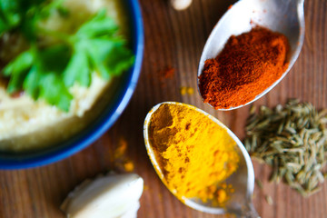 Healthy eating Background with herbs and spices selection on dark wooden table. Food or cooking concept, top view.