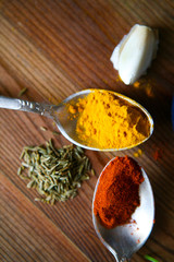 Healthy eating Background with herbs and spices selection on dark wooden table. Food or cooking concept, top view.