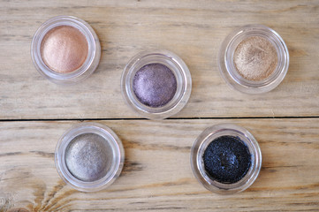 Many Eye Shadows On Wood Table