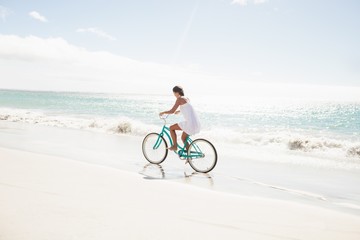  Carefree woman going on a bike ride 