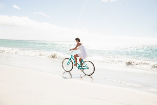  Carefree woman going on a bike ride 