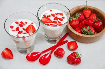 Red Fresh Strawberries are on the Cracker with Grains,Condensed Milk  on the White Paper.Breakfast Organic Healthy Tasty Food.Cooking Vitamins Ingredients.Summer Fruits.Selective Focus