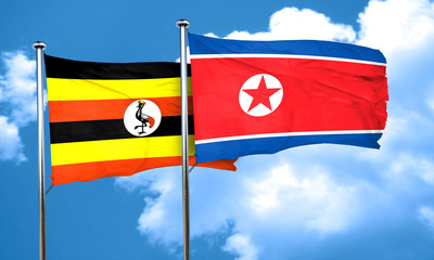 Uganda flag with North Korea flag, 3D rendering