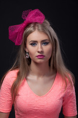Close-up portrait, isolated, Blonde model with pink bow